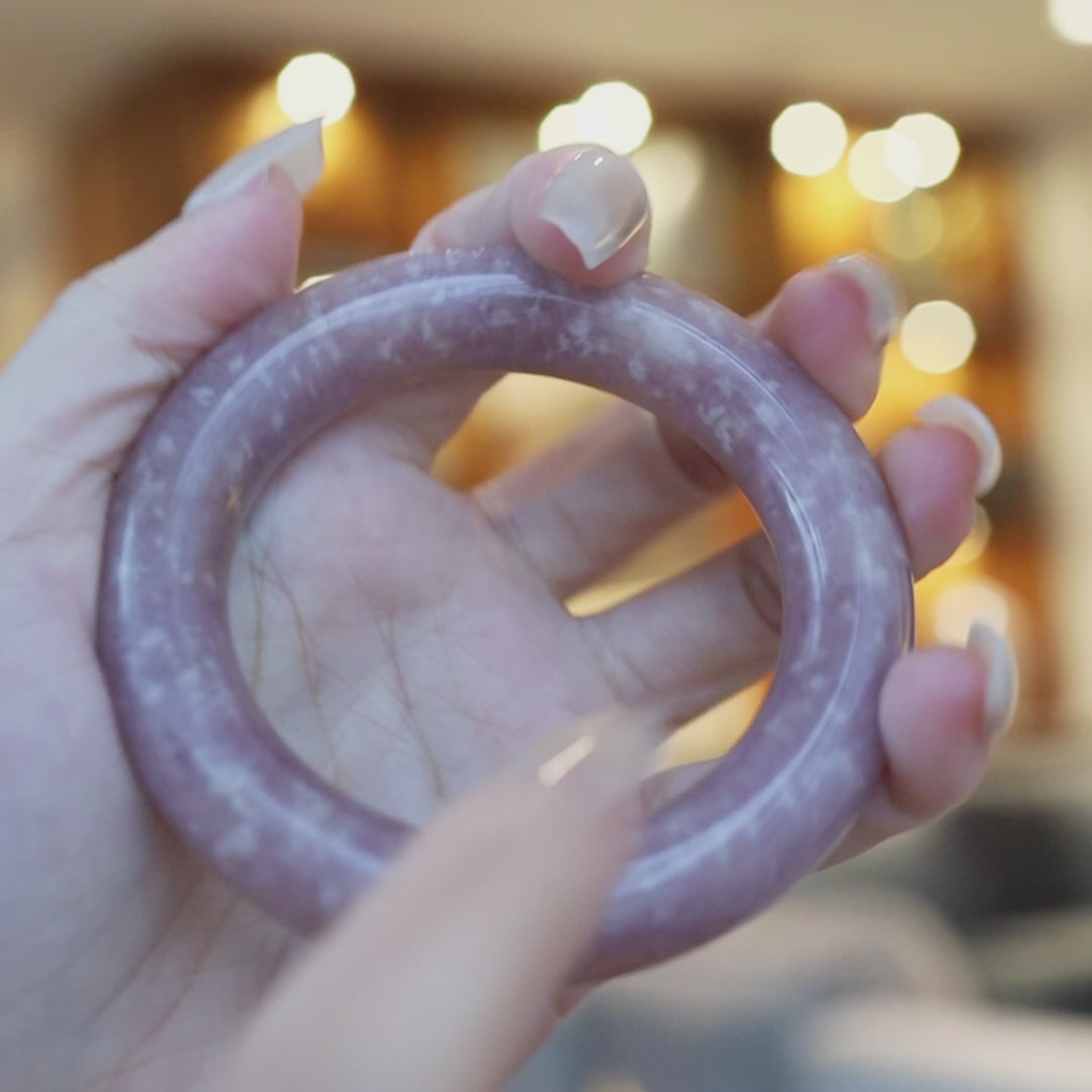 Soft orchid-hued Mongolian jade bracelet with delicate white speckles scattered across its smooth surface, resembling stars in twilight – Miruzi
