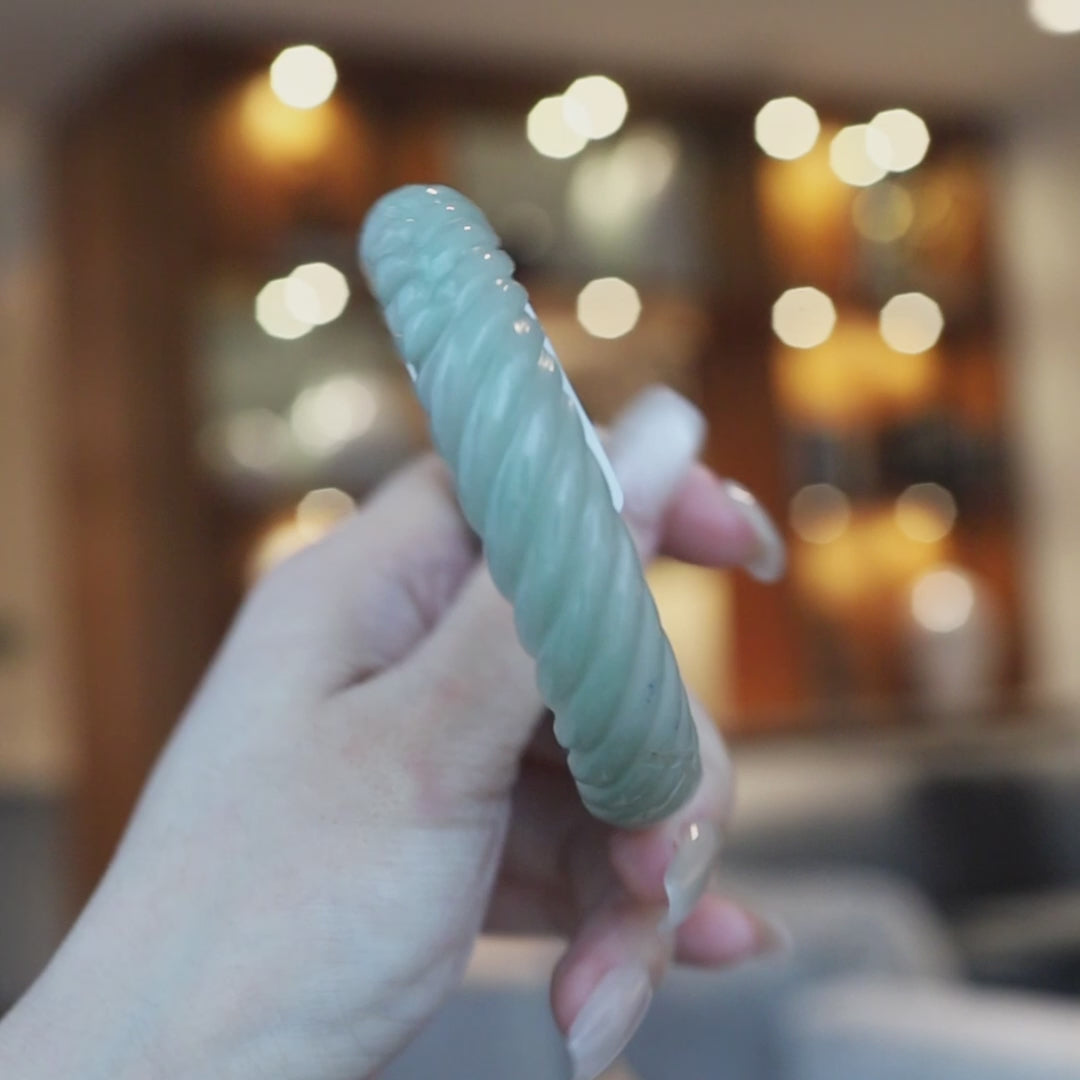 Hand-carved Mongolian green jade bangle featuring a continuous spiral twist and two subtle Yuanbao ingot carvings for prosperity – Miruzi